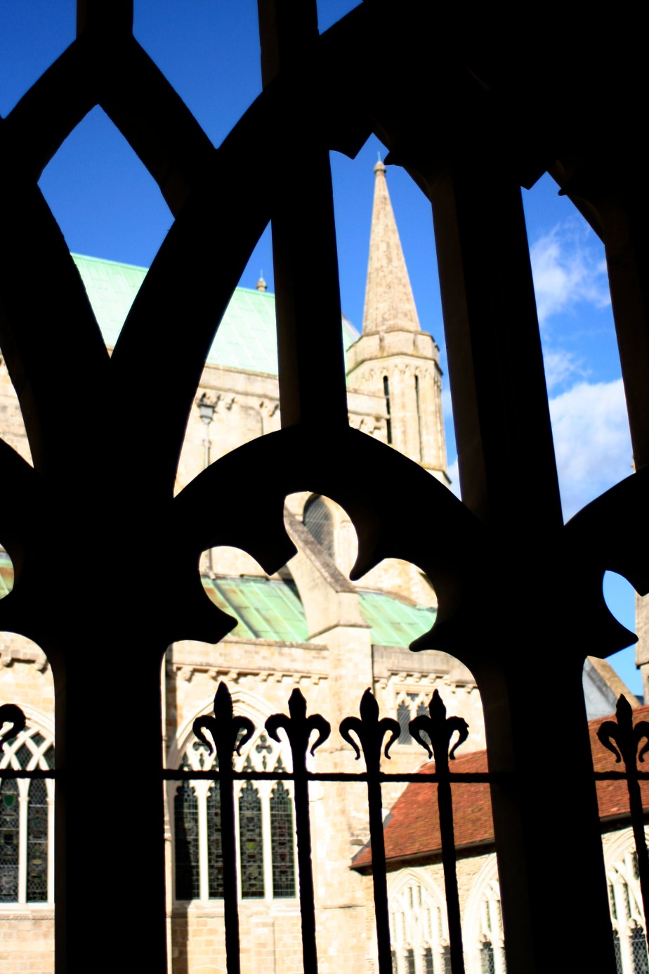 Chichester cathedral seen through cloister arches