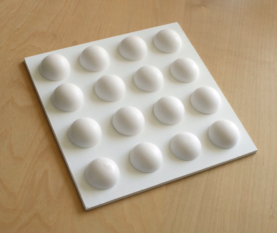 Soft daylight casting shadows over hemispherical arrangement