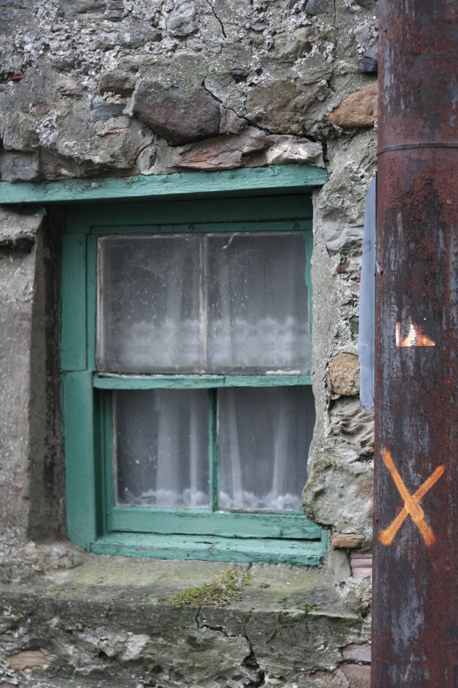 Green-painted window on Holy Island