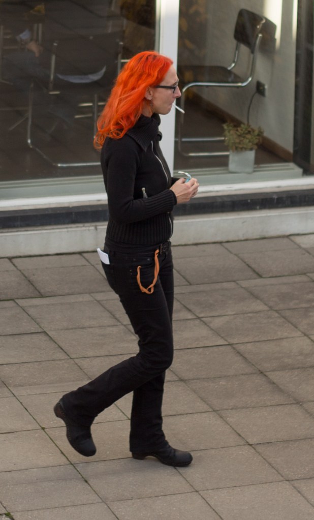 The reddest hair and the blackest clothes