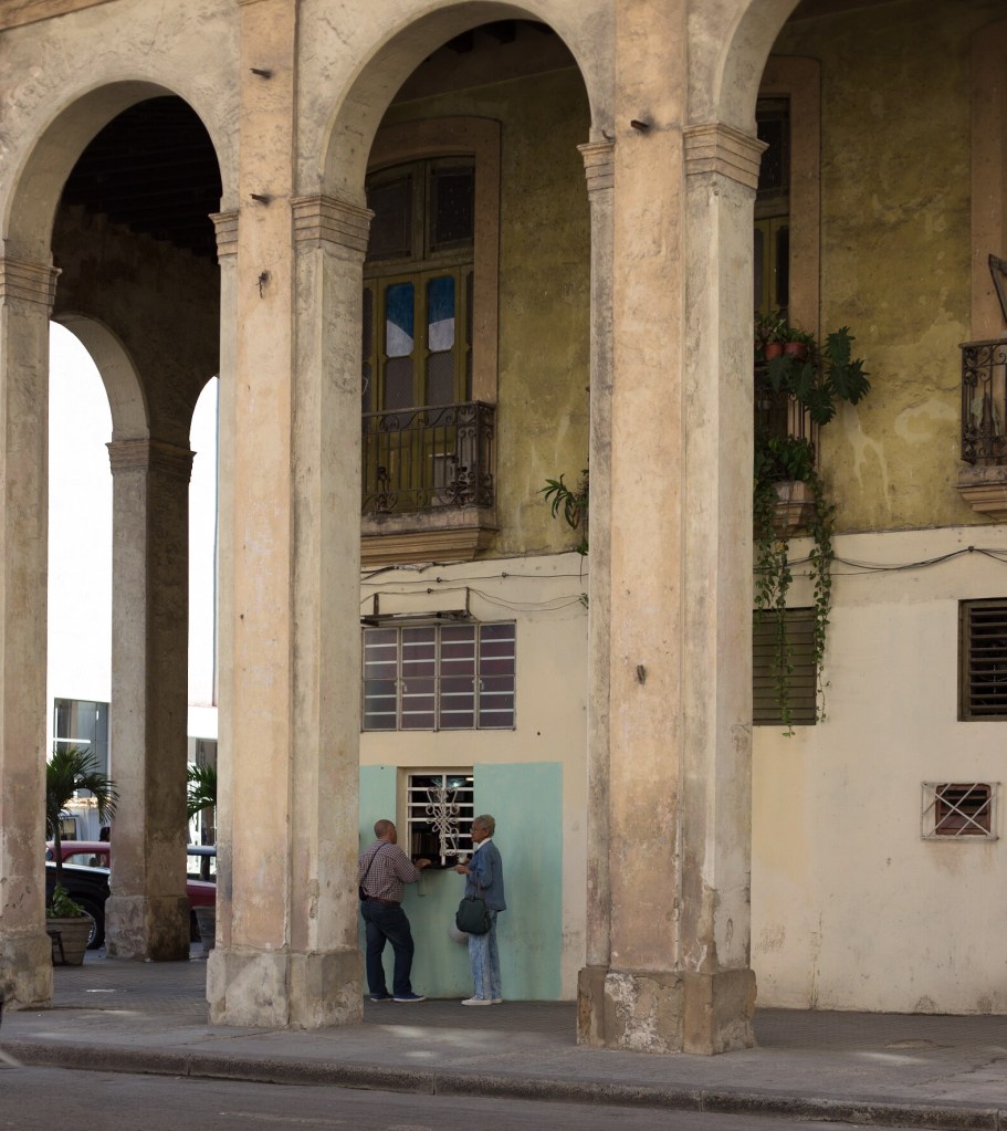 Spanish colonial style arcades provide welcome shelter from the sun as well as torrential rain. Tiny shops open at random selling hot drinks or cakes.