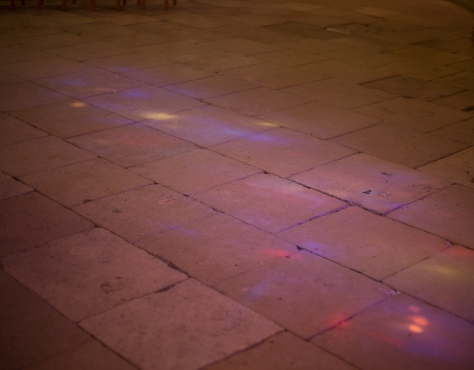 Even on a cloudy day the stained glass windows lay rich patterns across the pale stone floor in Cathedral de Bourges.