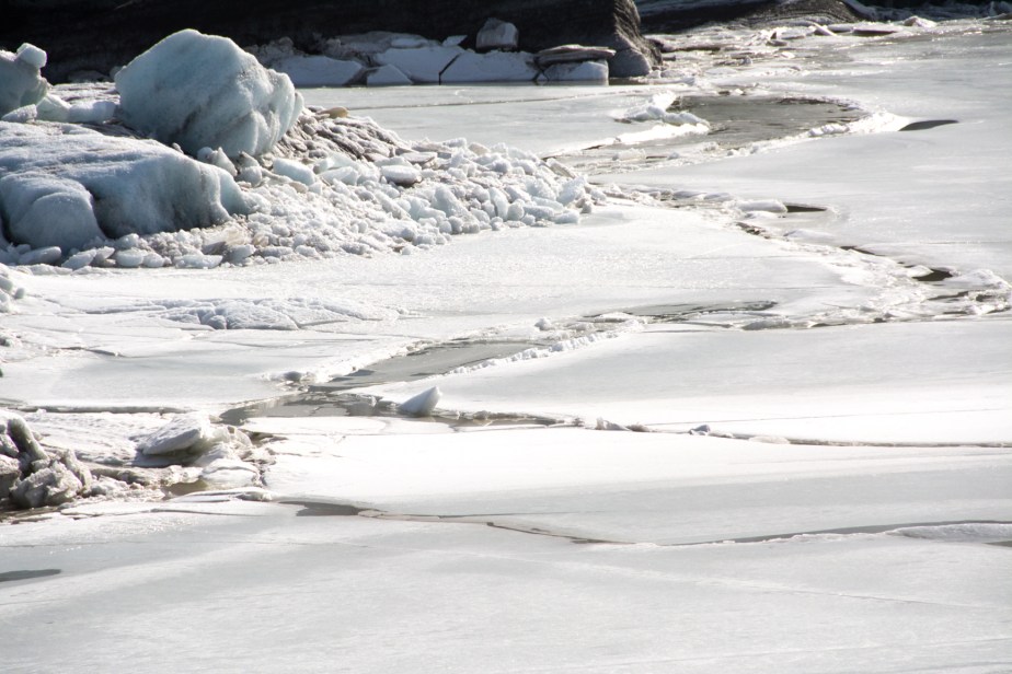 The end of the glacier where the melt water sits and freezes and melts over and over. Cracks appear and close, fallen rock become trapped on the ever-changing surface.